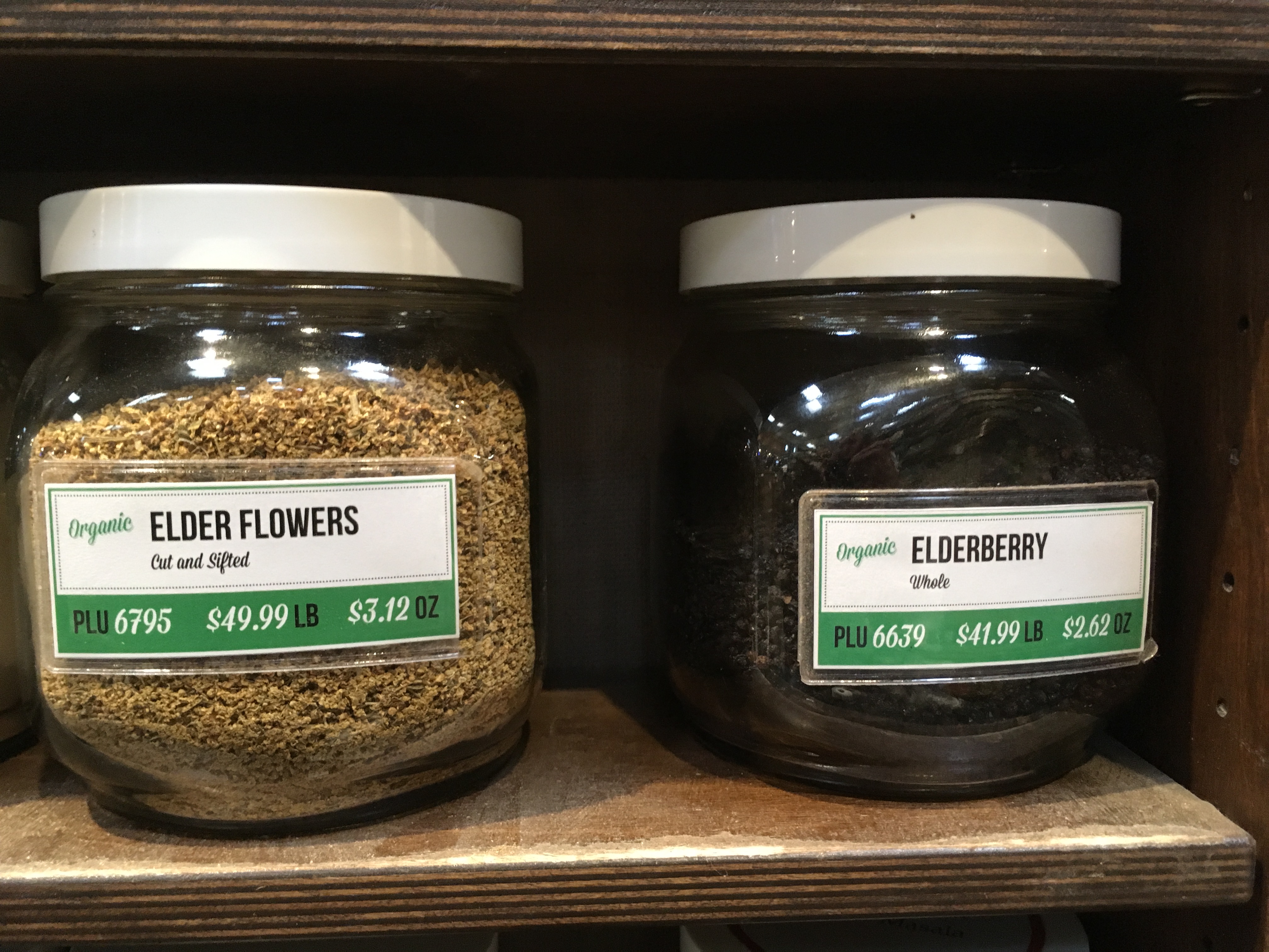 Jars of elderberry product on a supermarket shelf