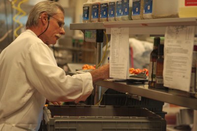 Front line workers directly interact with food products during work.