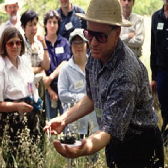 Man leading a soil demonstration at a field day