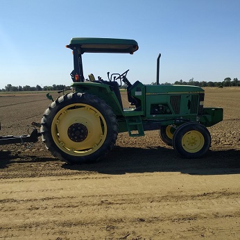 a tractor in a farm field