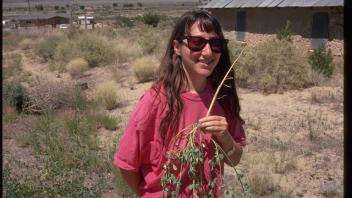 woman holding sweetclover plant