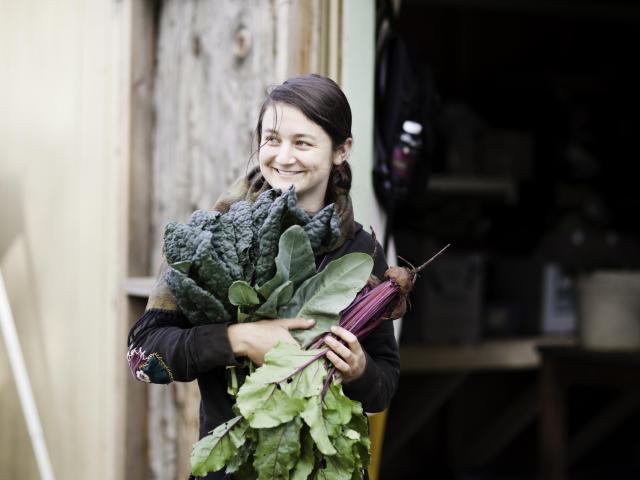 Woman holding freshly picked organic produce